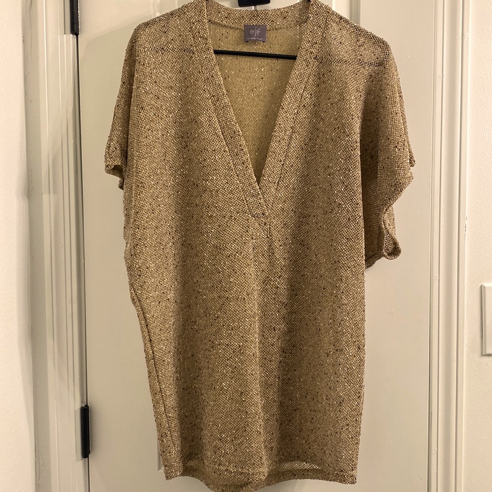 This stylish tunic is slightly see through so wear a cami or tee underneath